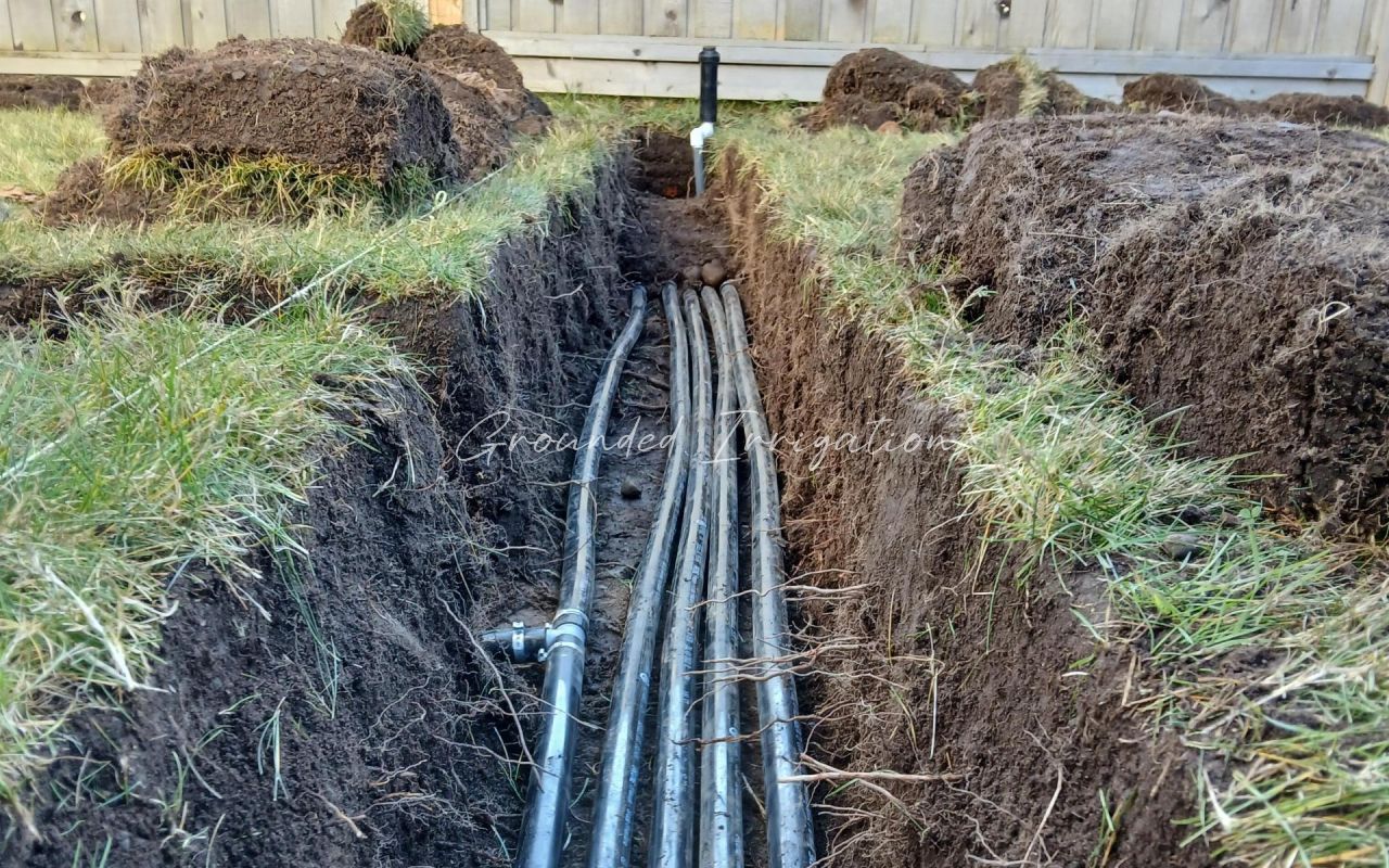 long trench with five pipes and swing arm